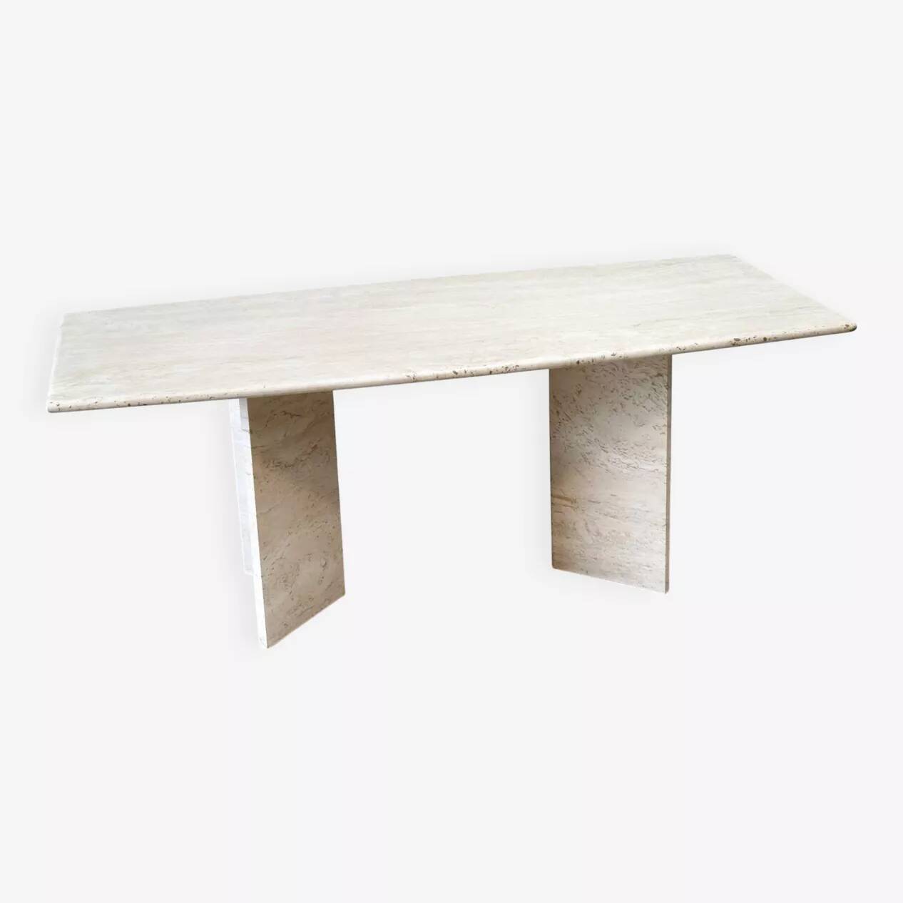 Sculptural travertine dining table