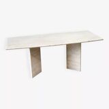 Sculptural travertine dining table