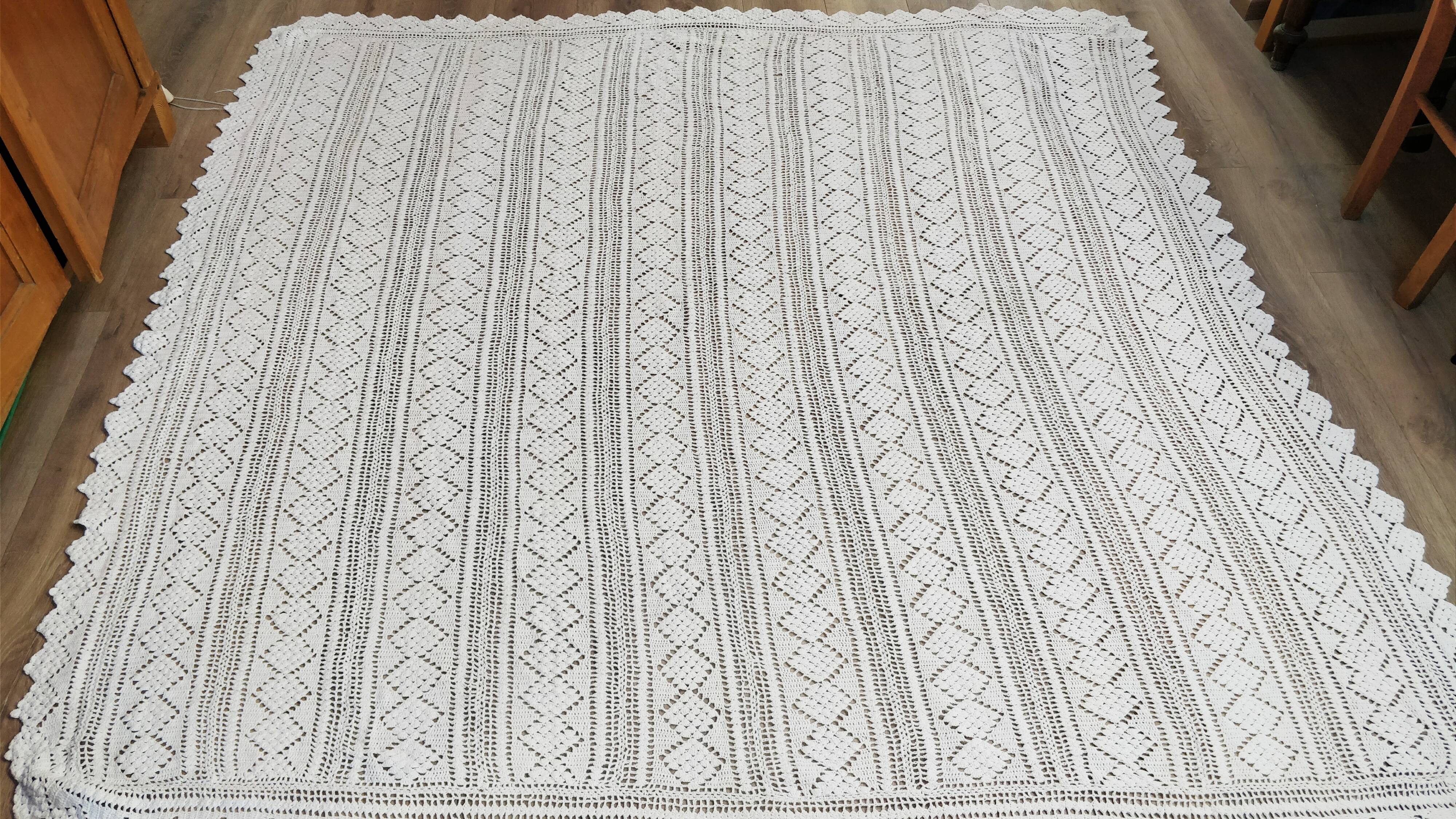 White two-seater crocheted bed top