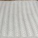 White two-seater crocheted bed top