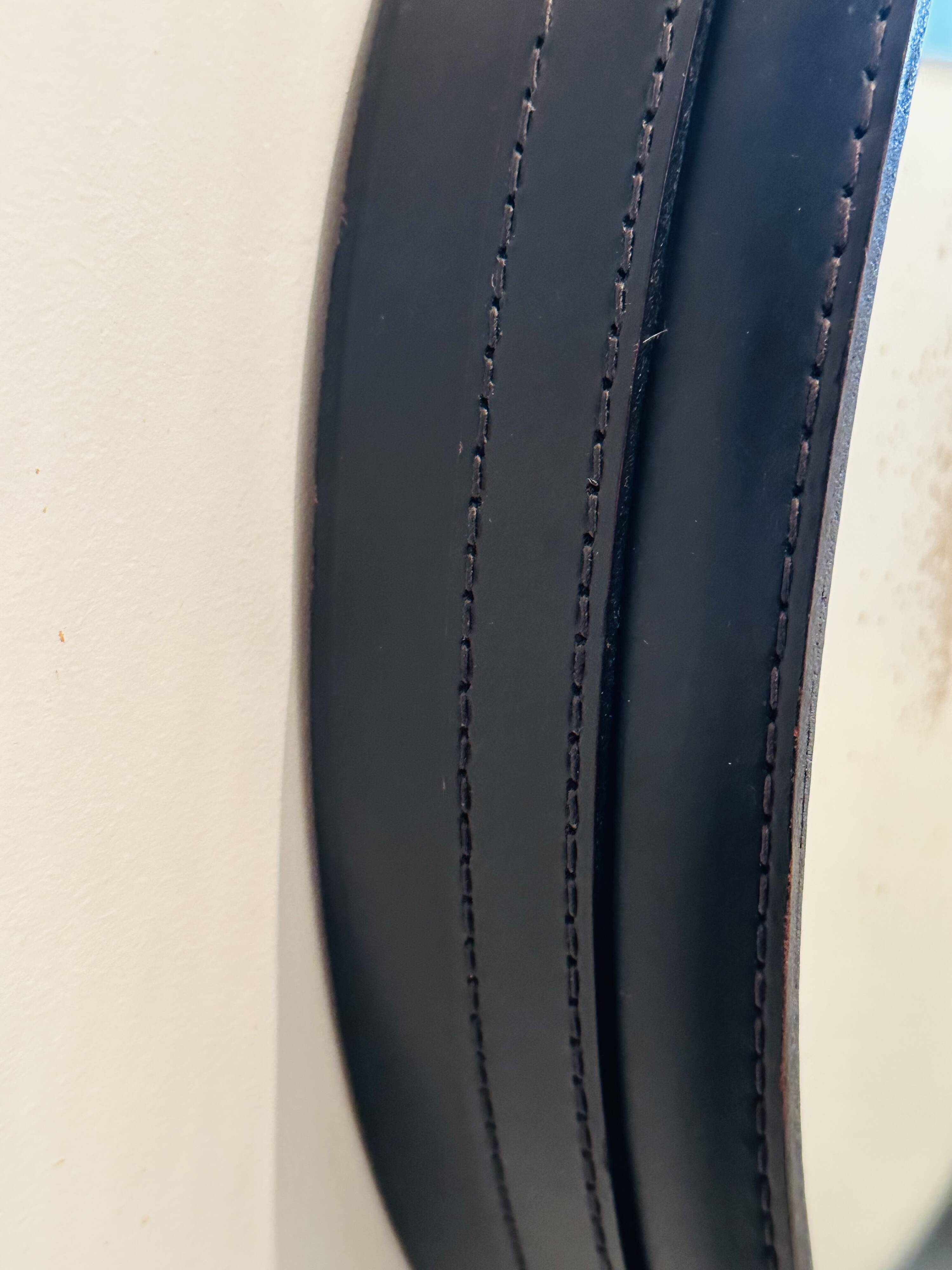 Jacques Adnet circular leather and brass mirror