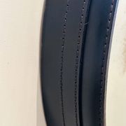 Jacques Adnet circular leather and brass mirror