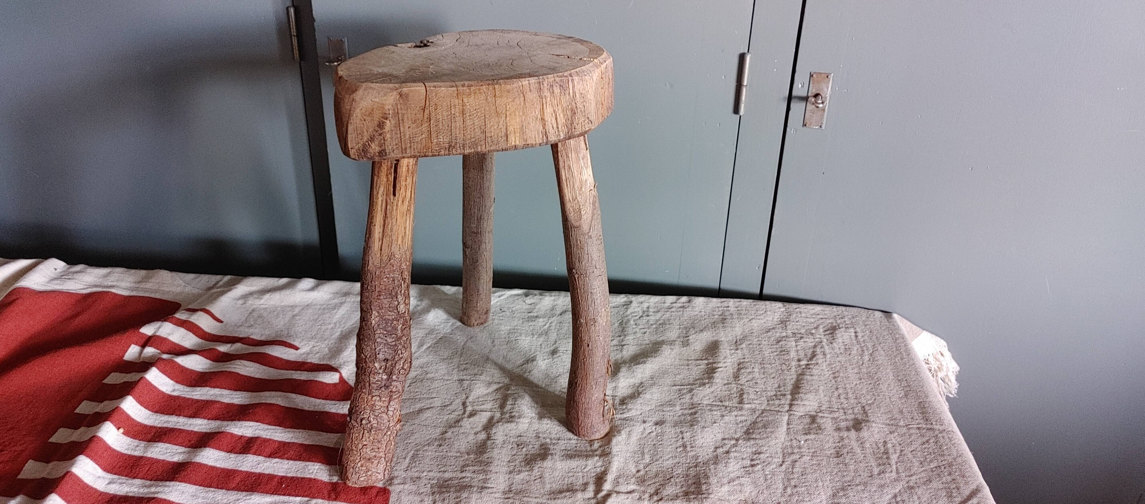 Old small country stool in raw wood - tripod base