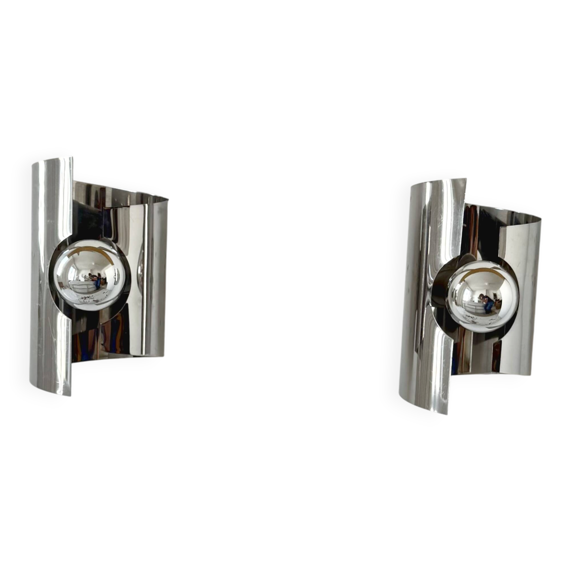 Pair of vintage wall lights, curved chrome metal, France, 1970.