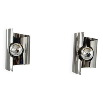 Pair of vintage wall lights, curved chrome metal, France, 1970.