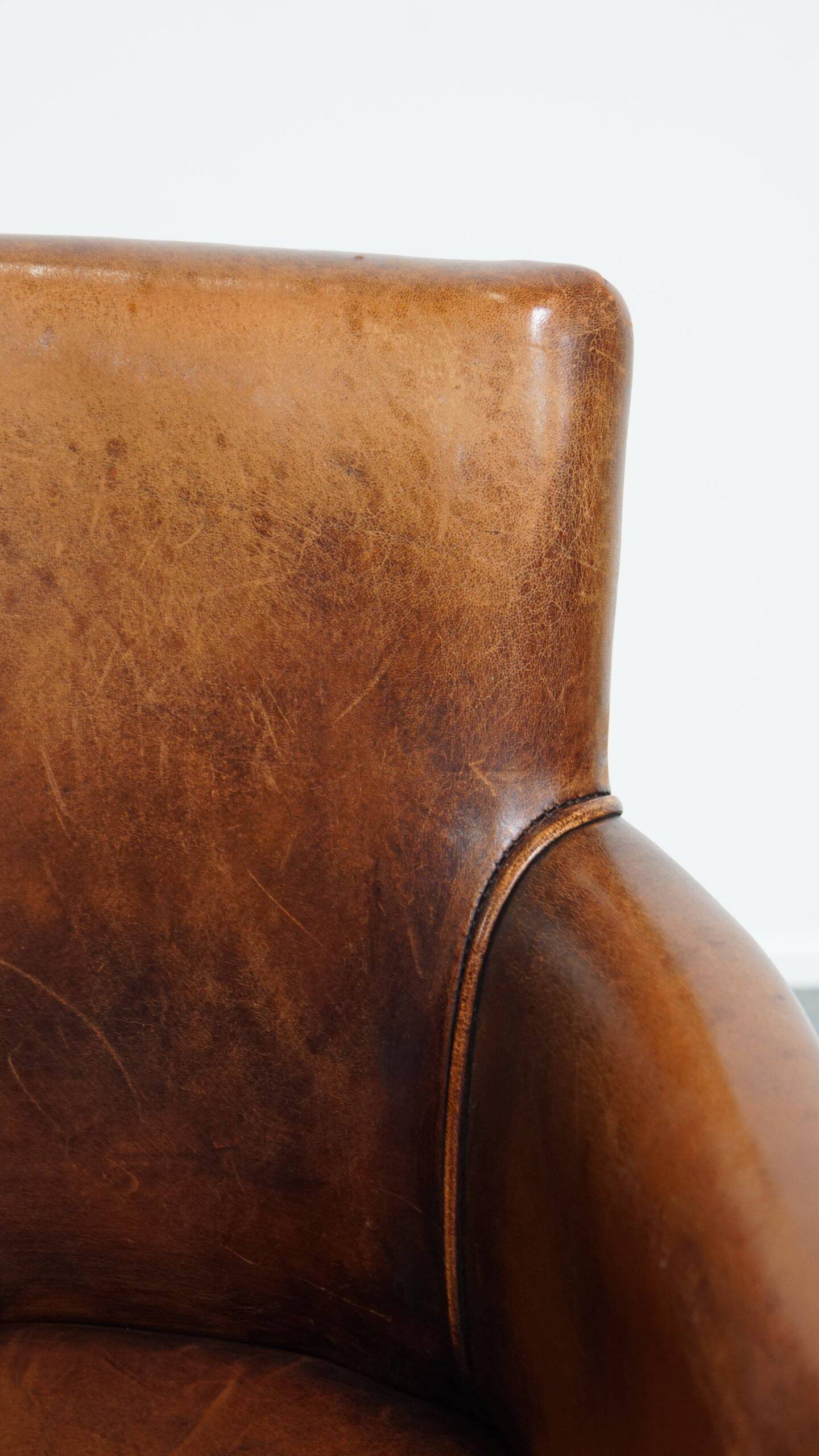 Amazing cognac-coloured sheepskin dining/side chair with armrests