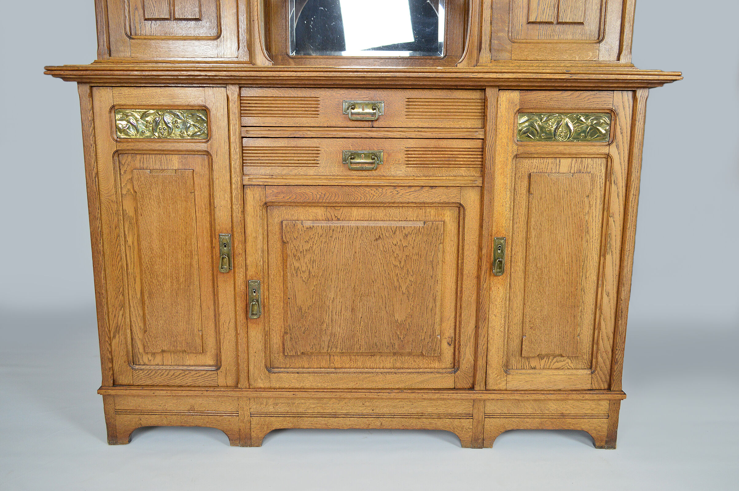 Art Nouveau oak buffet and dinanderie panels, circa 1910