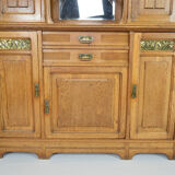 Art Nouveau oak buffet and dinanderie panels, circa 1910