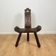 Pair of low tripod chairs in solid wood, mid-20th century.