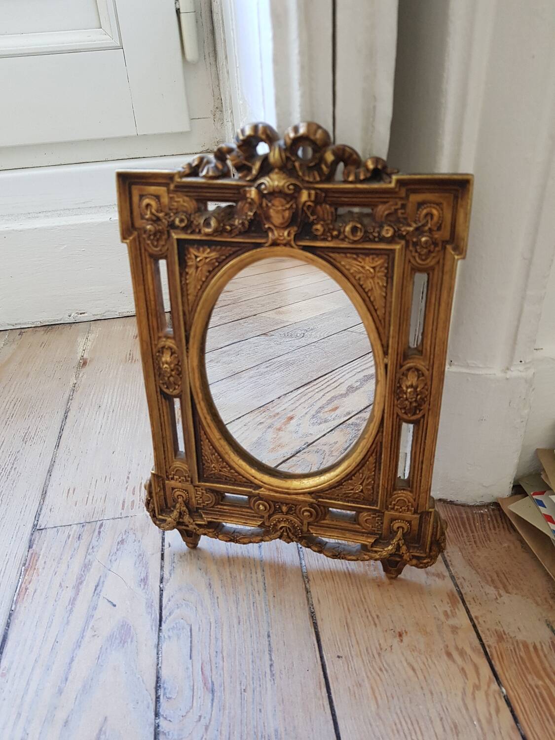 Old small golden mirror