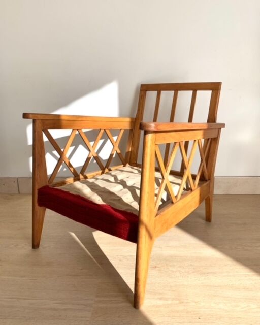 Pair of vintage wooden armchairs with braces