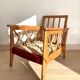 Pair of vintage wooden armchairs with braces
