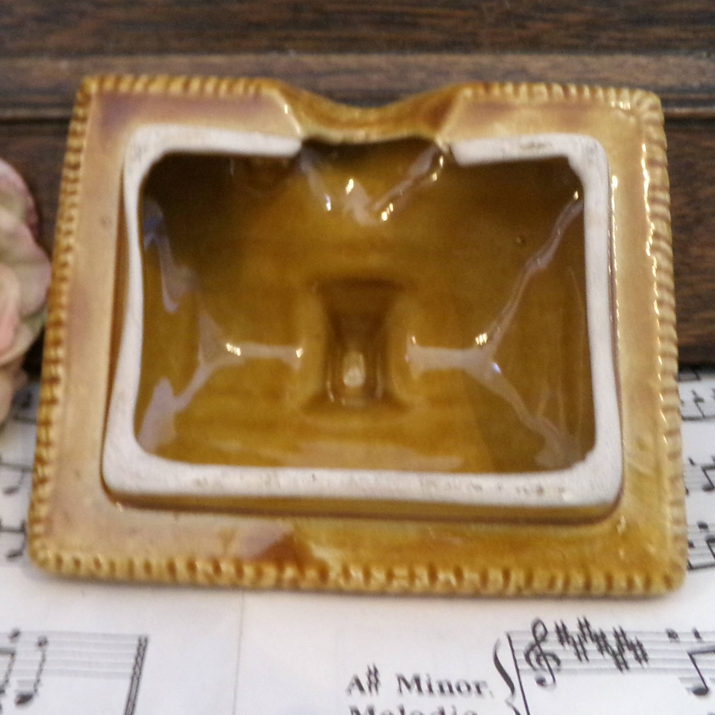 Devonway jam pot in the shape of a cottage with a thatched roof.