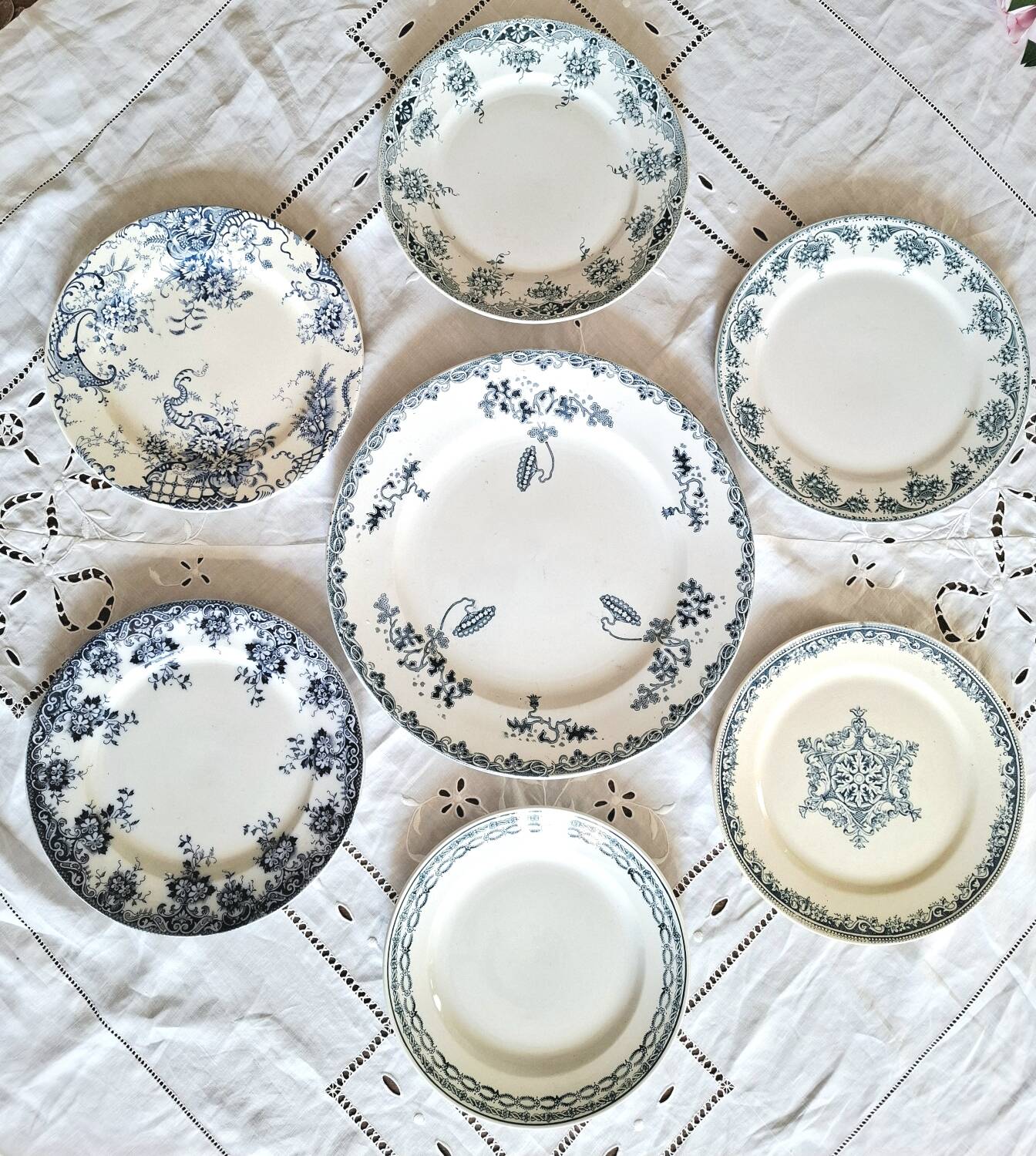 Antique earthenware dessert plates accompanied by a dish