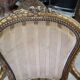 Paire de fauteuils en bois dore style Louis XVl