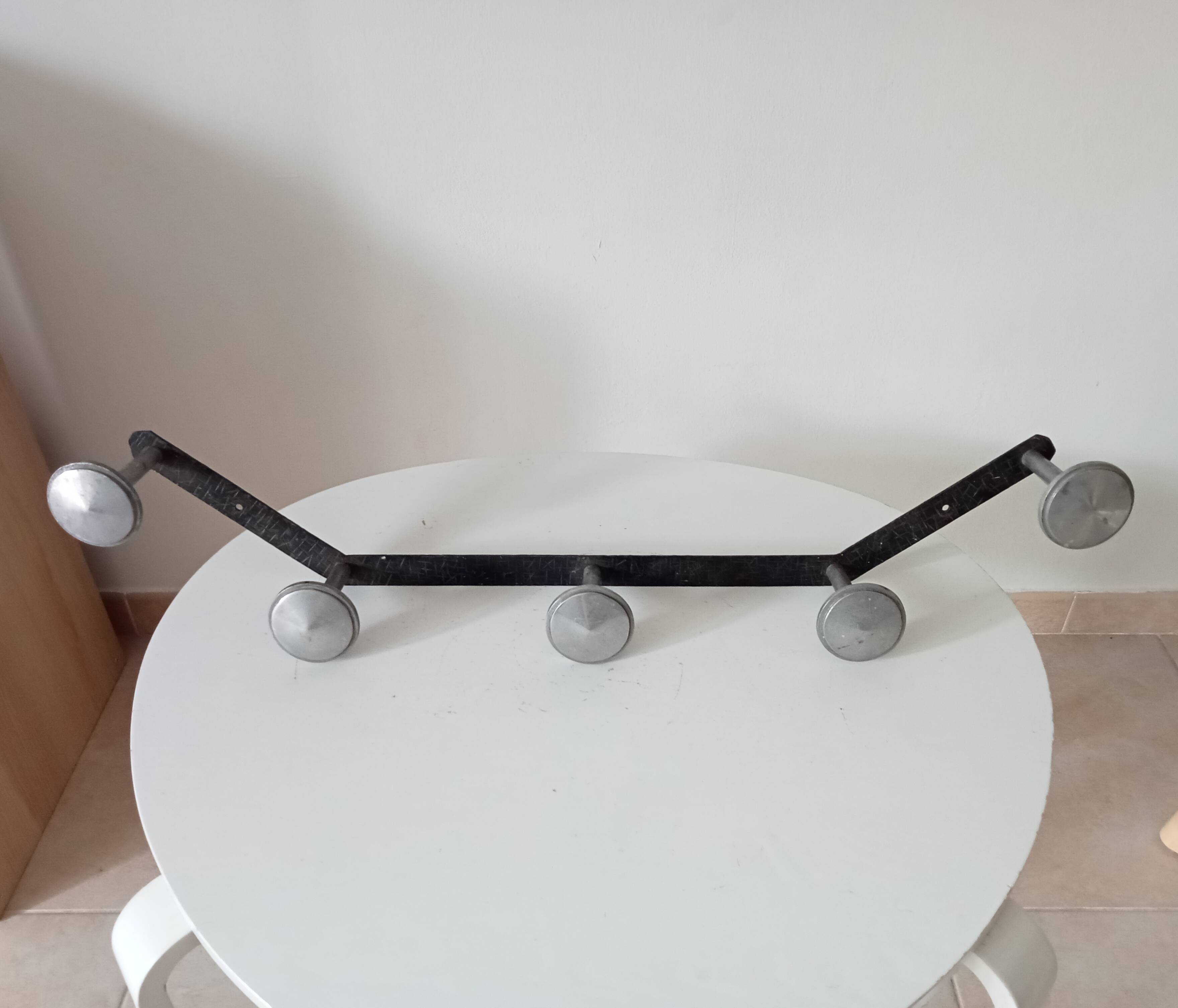 Vintage 1950s wall coat rack, wrought iron with chiselled details and solid aluminium.
