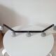 Vintage 1950s wall coat rack, wrought iron with chiselled details and solid aluminium.