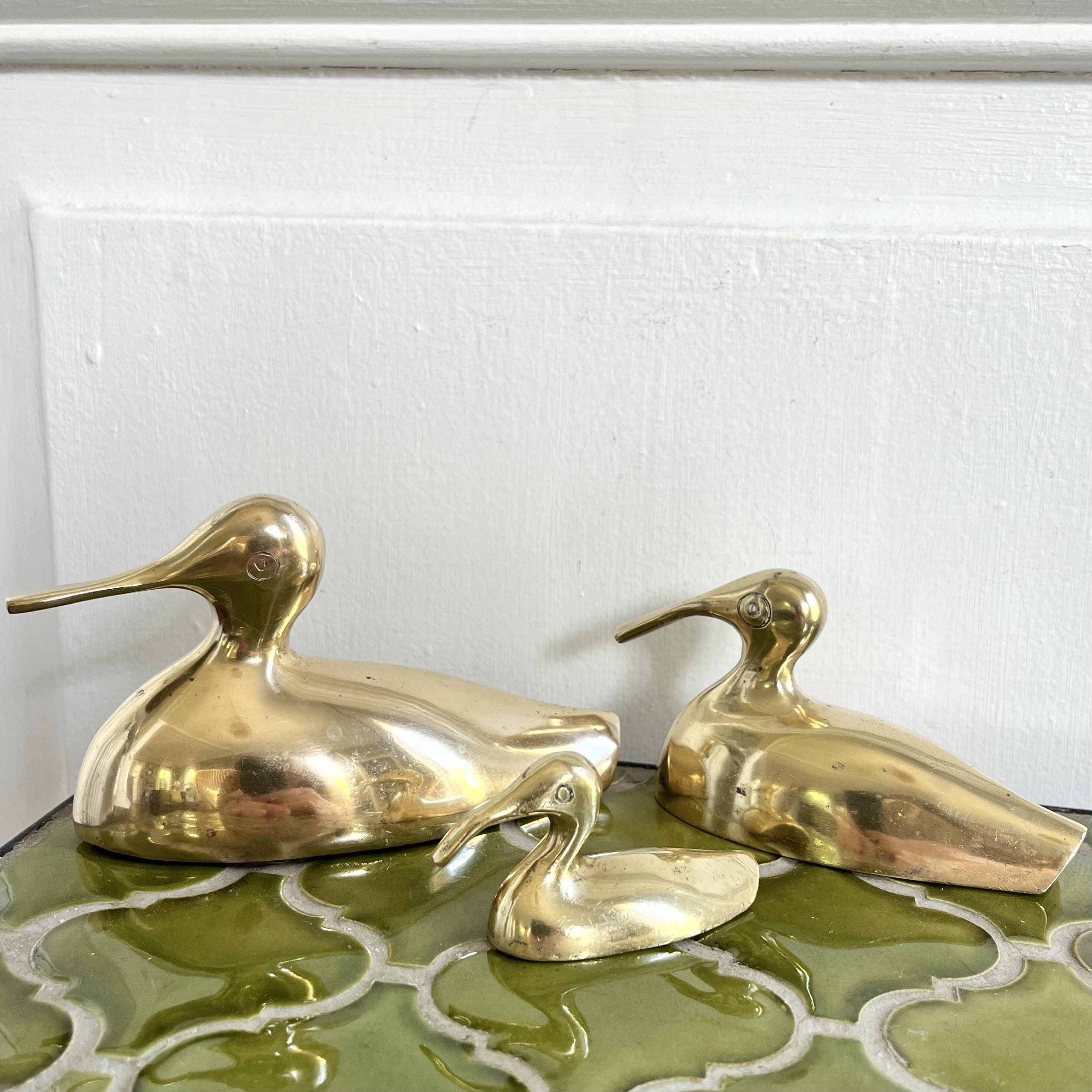 Three brass ducks from the 1950s