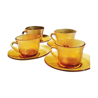 Set of coffee cups and amber glass saucers