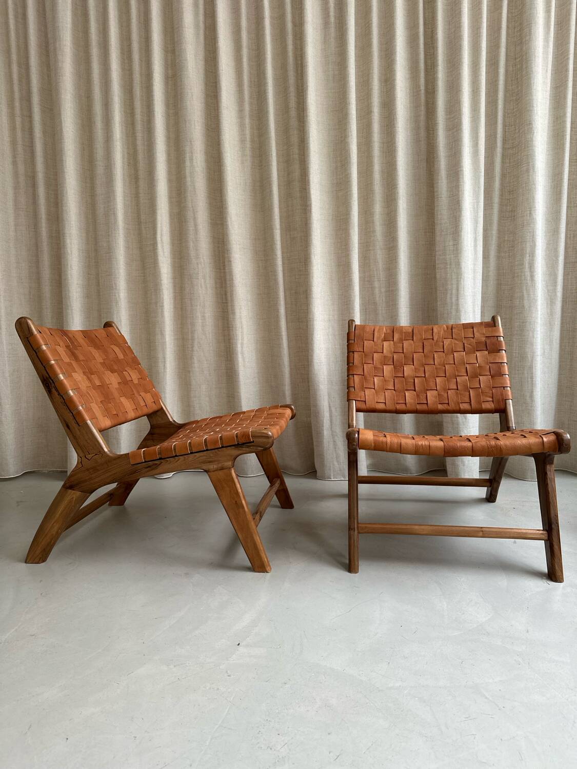 Pair of leather and walnut armchairs