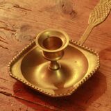 Old brass hand candle holder