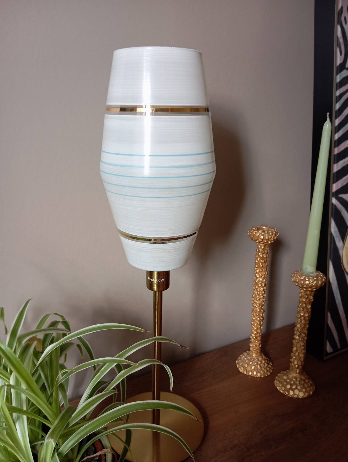 Mid-century gold metal table lamp with white striped shade