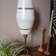 Mid-century gold metal table lamp with white striped shade