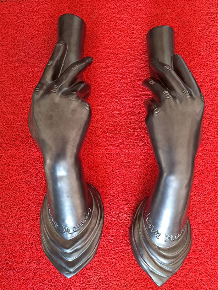 Pair of sculptural ceramic wall lights by Jean Marais