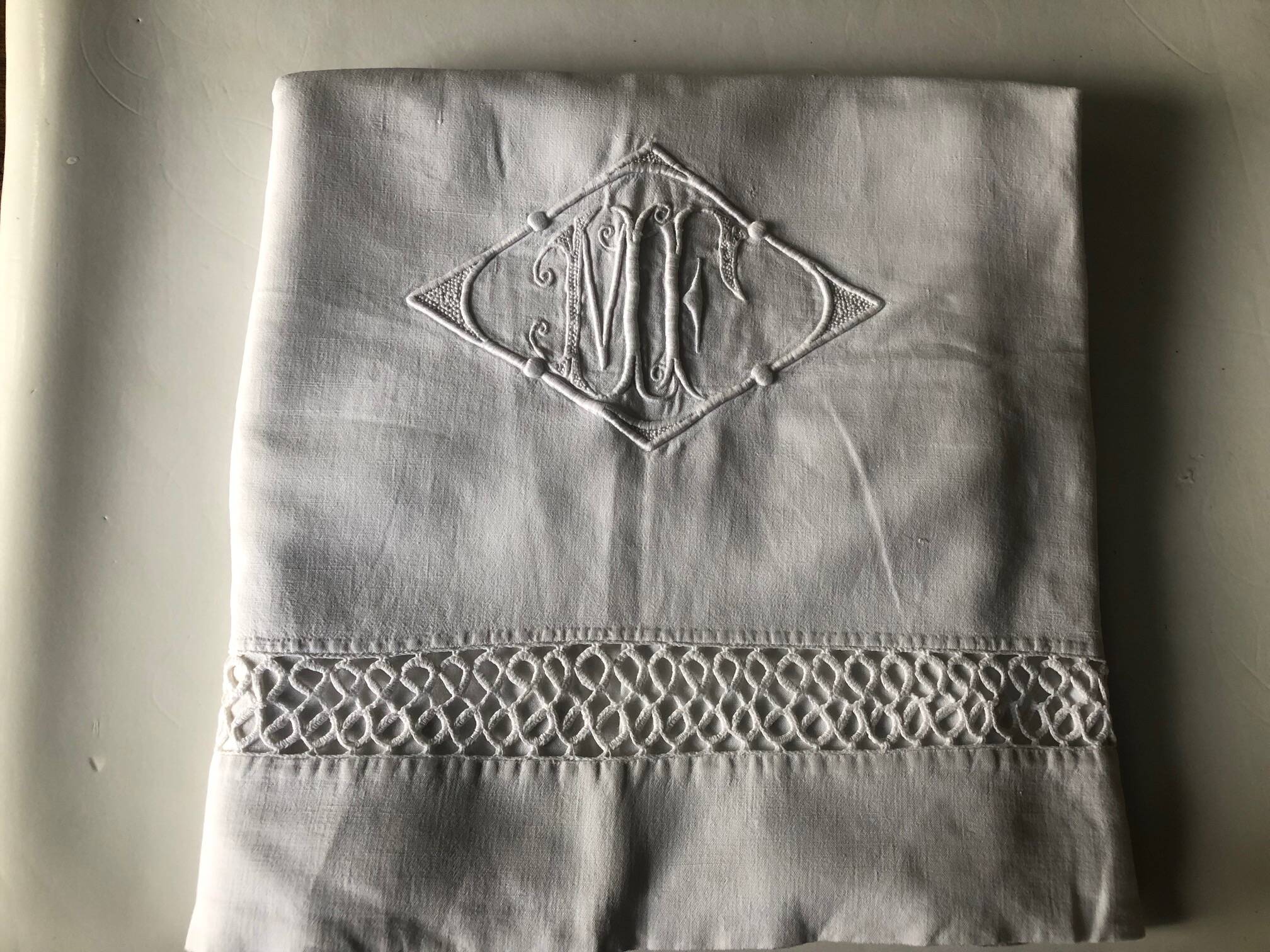 Similar listings: Antique cotton sheet embroidered with the monogram MF