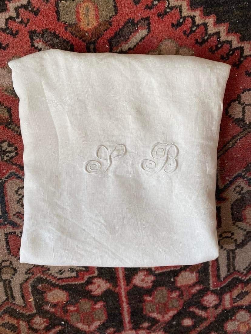 Old tablecloth in white cotton and monogram