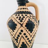 Raw and black terracotta jug