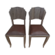 Two restyled leather-style chairs with nails