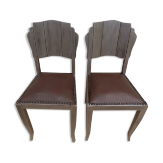 Two restyled leather-style chairs with nails