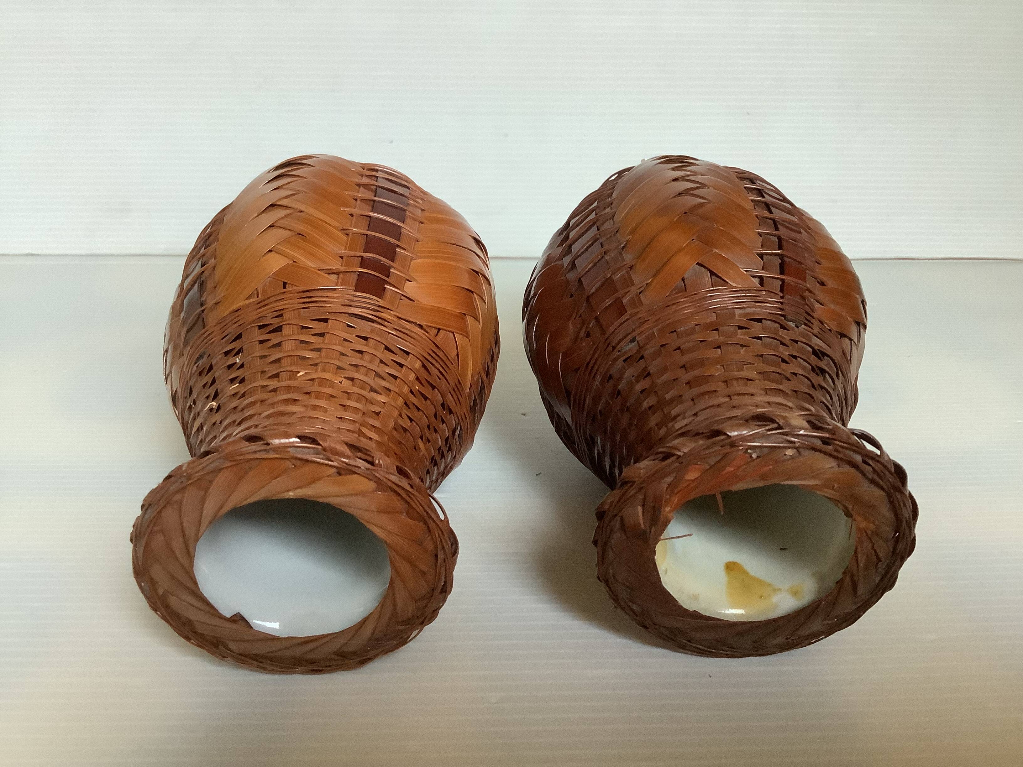 Pair of small woven vases in wicker rattan straw