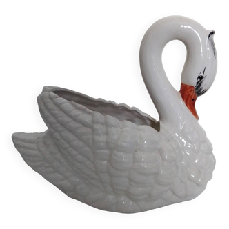 ceramic pot cover in the shape of a swan