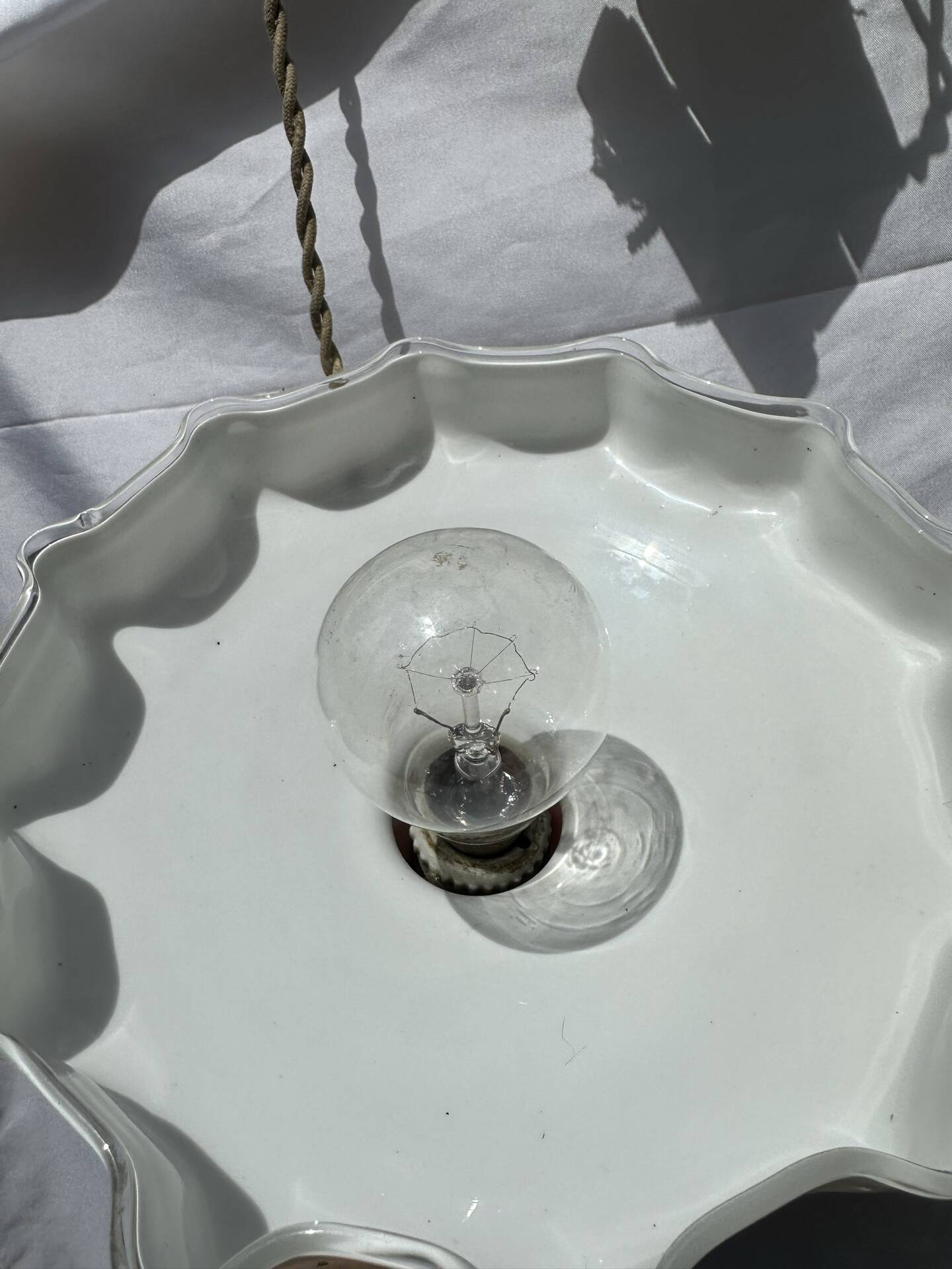 Vintage pleated opaline suspension with porcelain fittings.