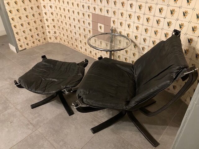 Leather Falcon armchair and footrest