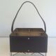Leather, brass and gold metal bottle holder