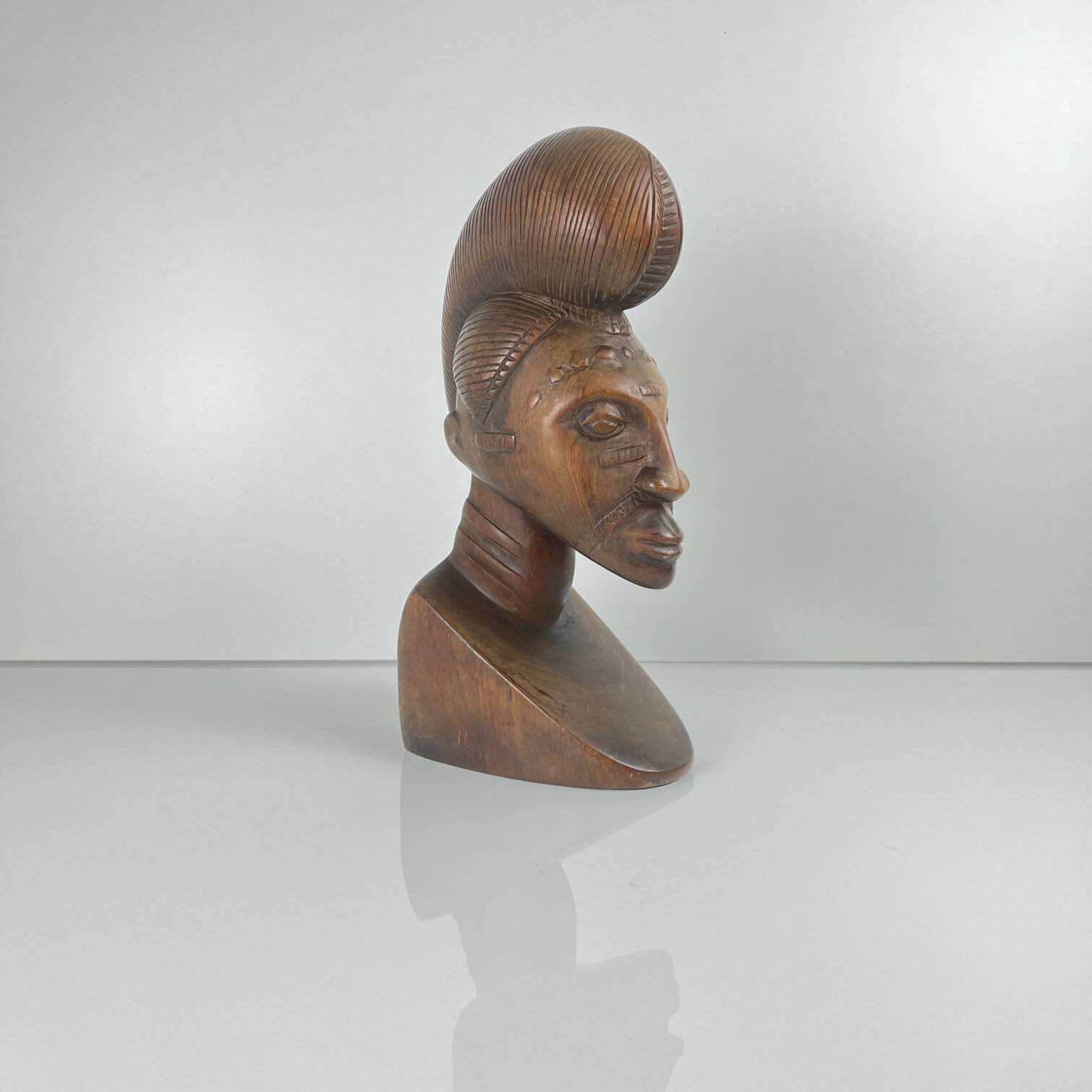 Hand-carved female bust in black wood, Baoulé style, 1960/90