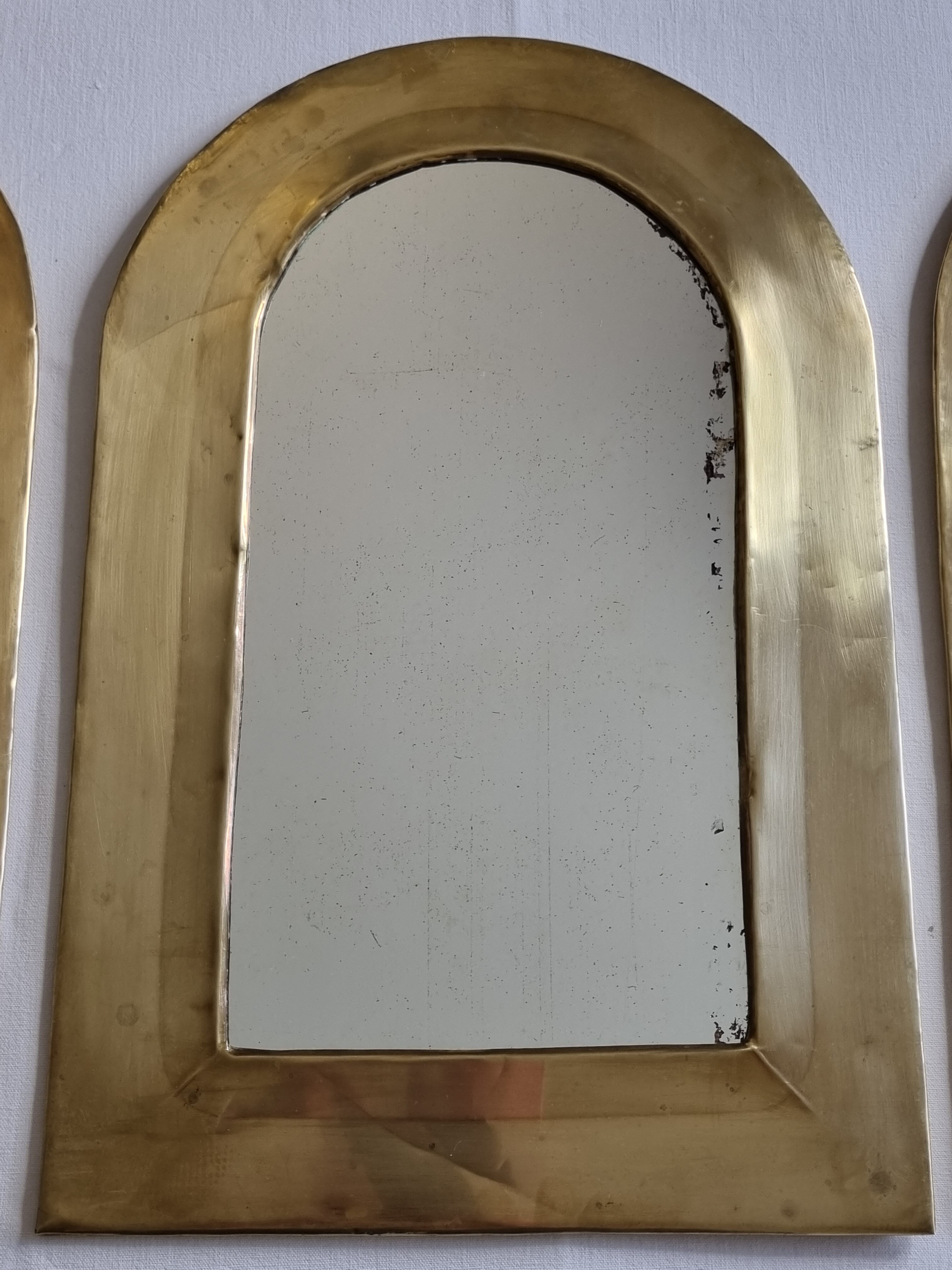 Set of three Moroccan brass mirrors in the form of arches, 43 cm