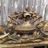 Wooden fireplace mirror and Gilded Louis XVI-style plaster with leaf