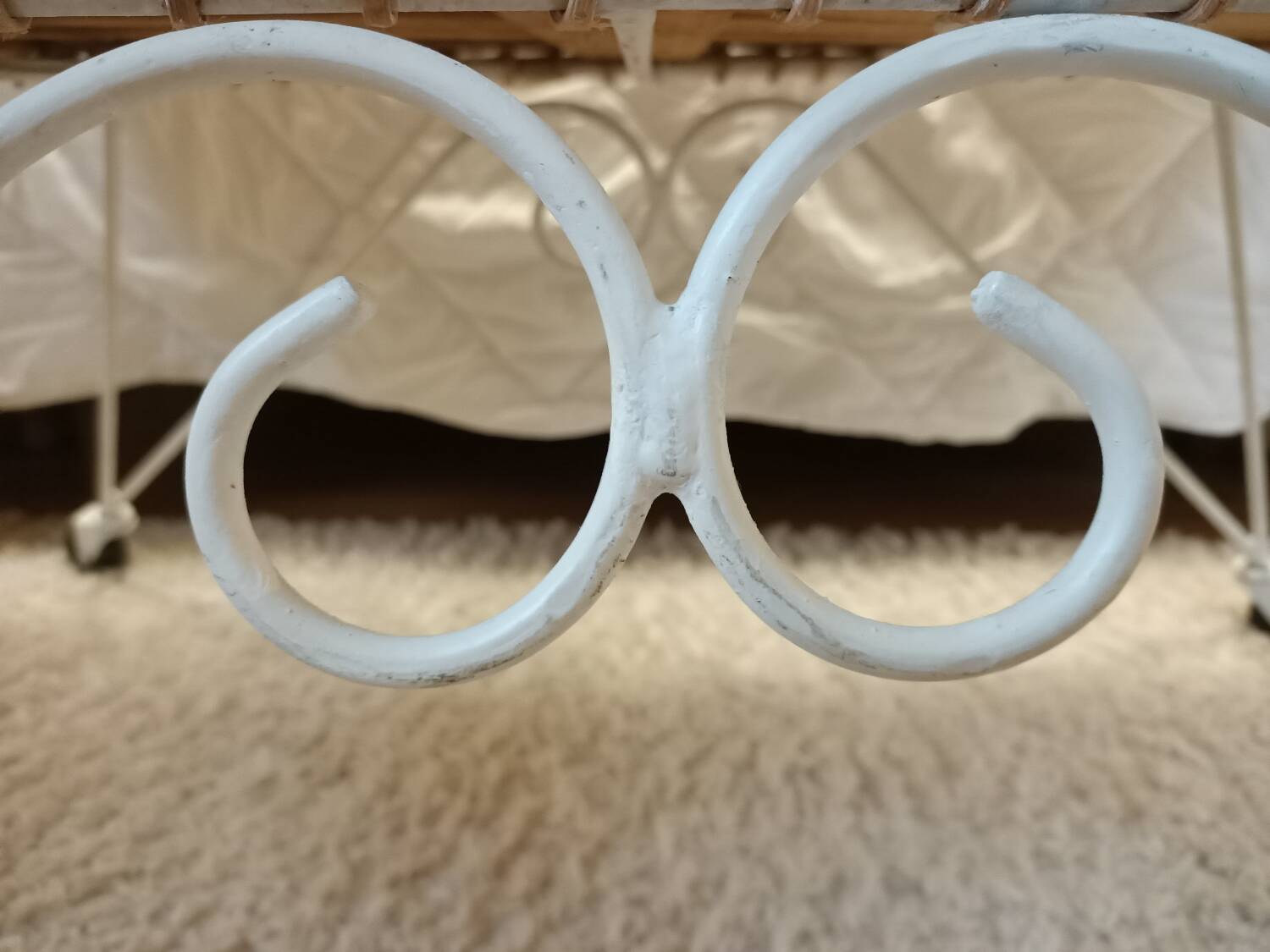 Rattan and wrought iron cradle