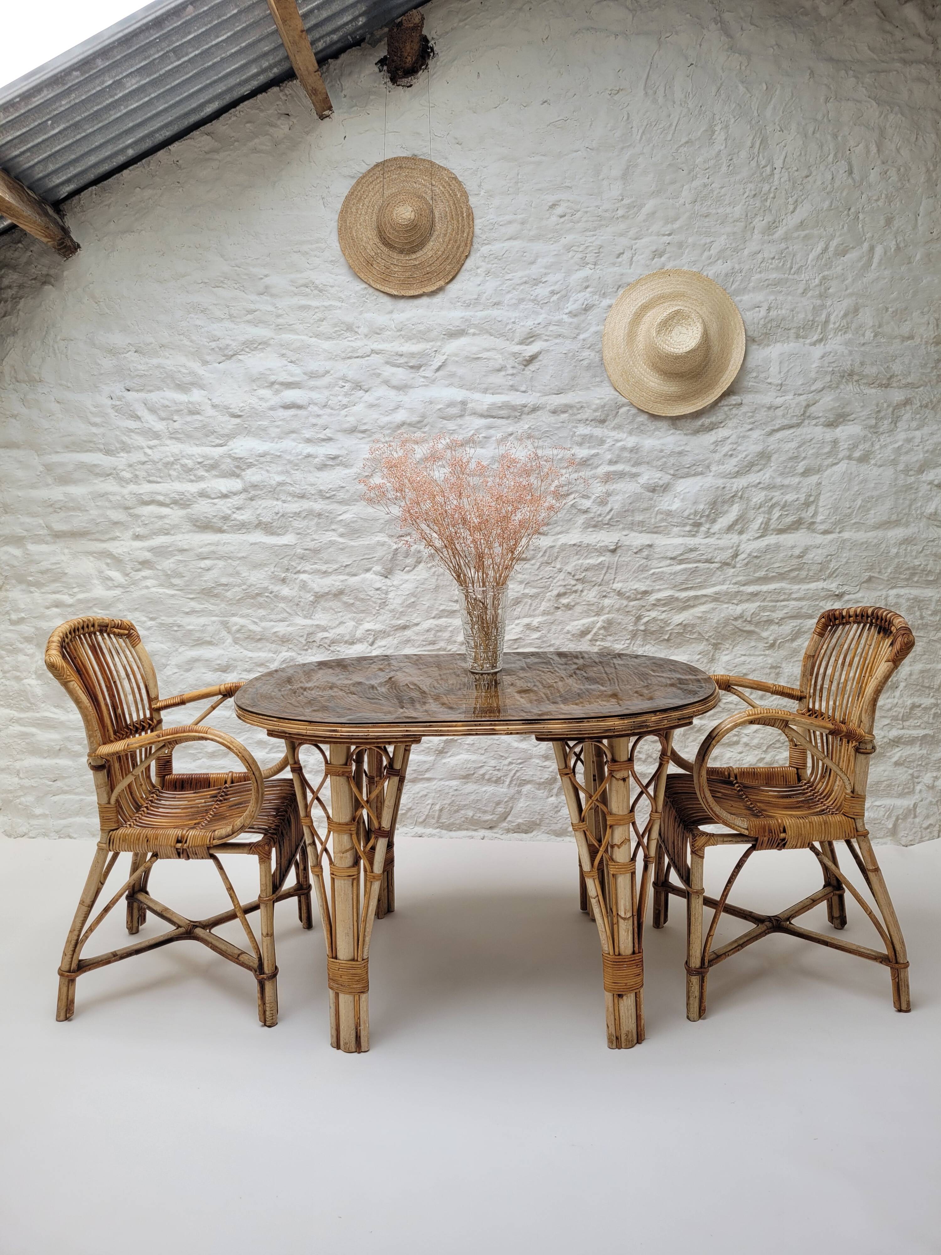 Vintage Audoux Minet bamboo, rattan, and smoked glass table duo.