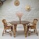 Vintage Audoux Minet bamboo, rattan, and smoked glass table duo.
