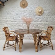 Vintage Audoux Minet bamboo, rattan, and smoked glass table duo.