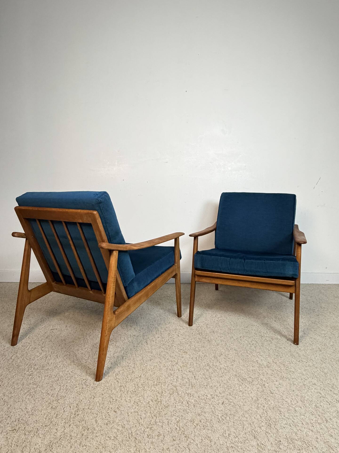 a pair of Scandinavian armchairs in teak from the 1960s