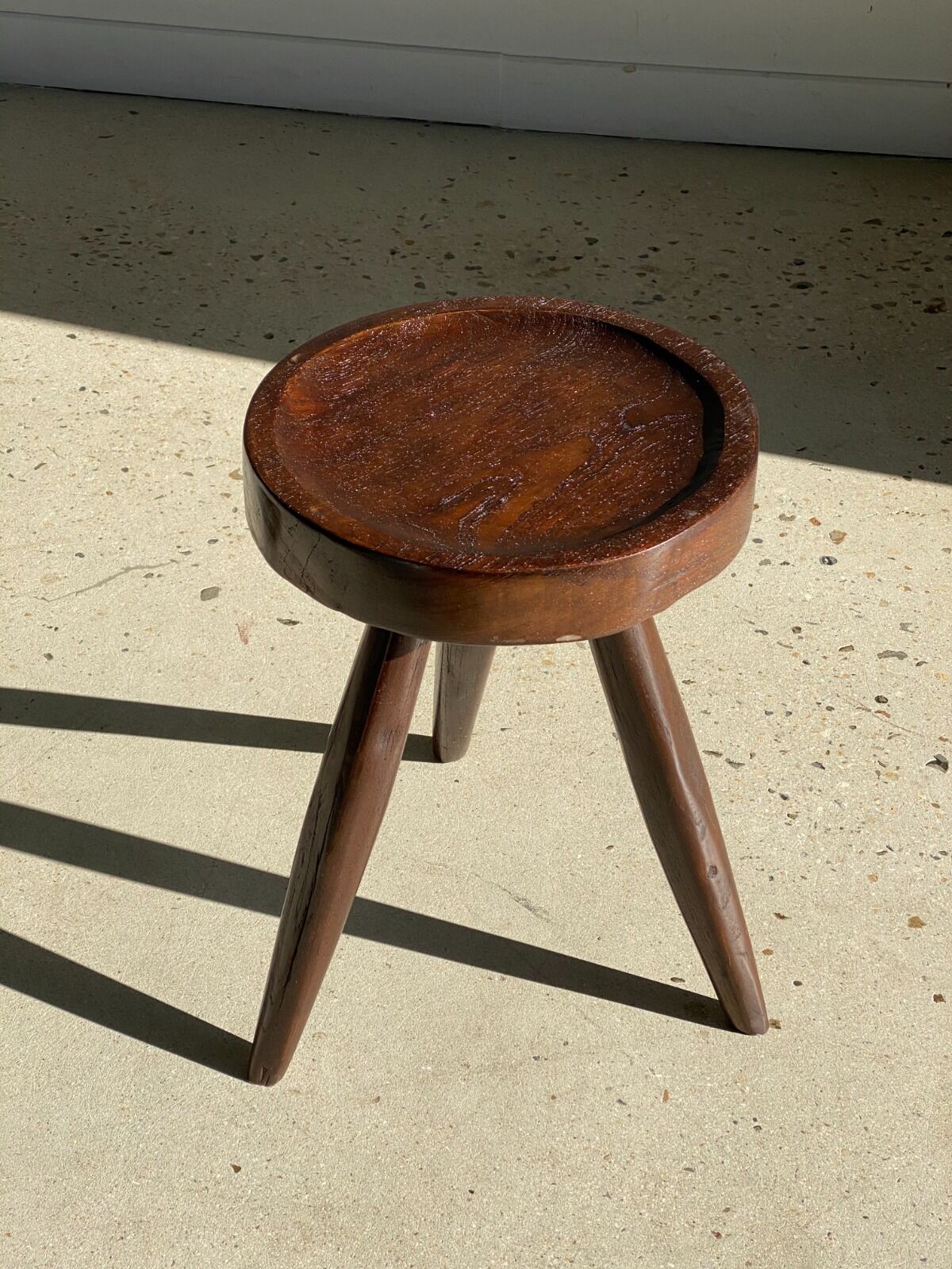 Brown solid wood stool seated circular dug