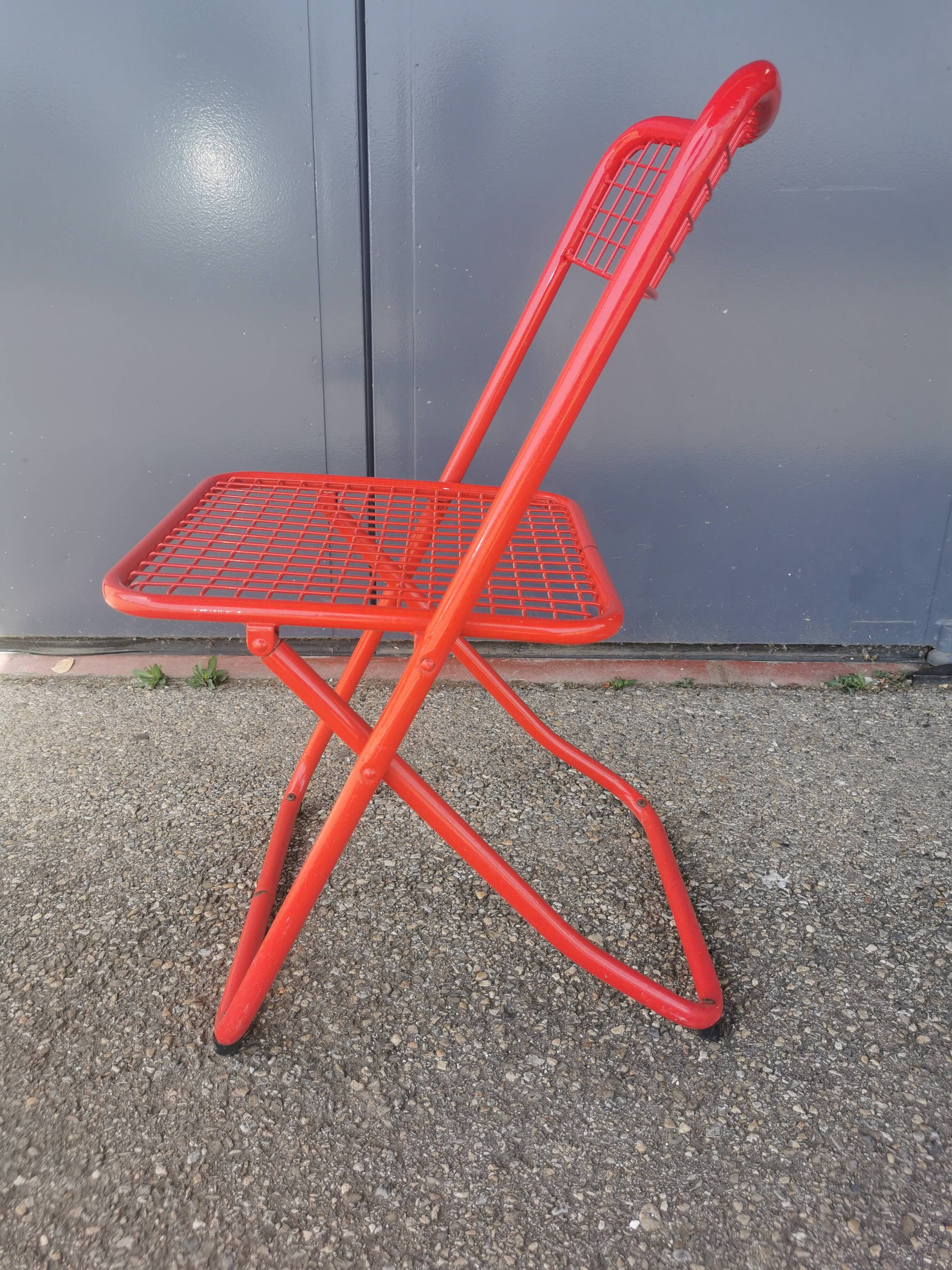 Vintage red metal folding chair