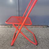 Vintage red metal folding chair