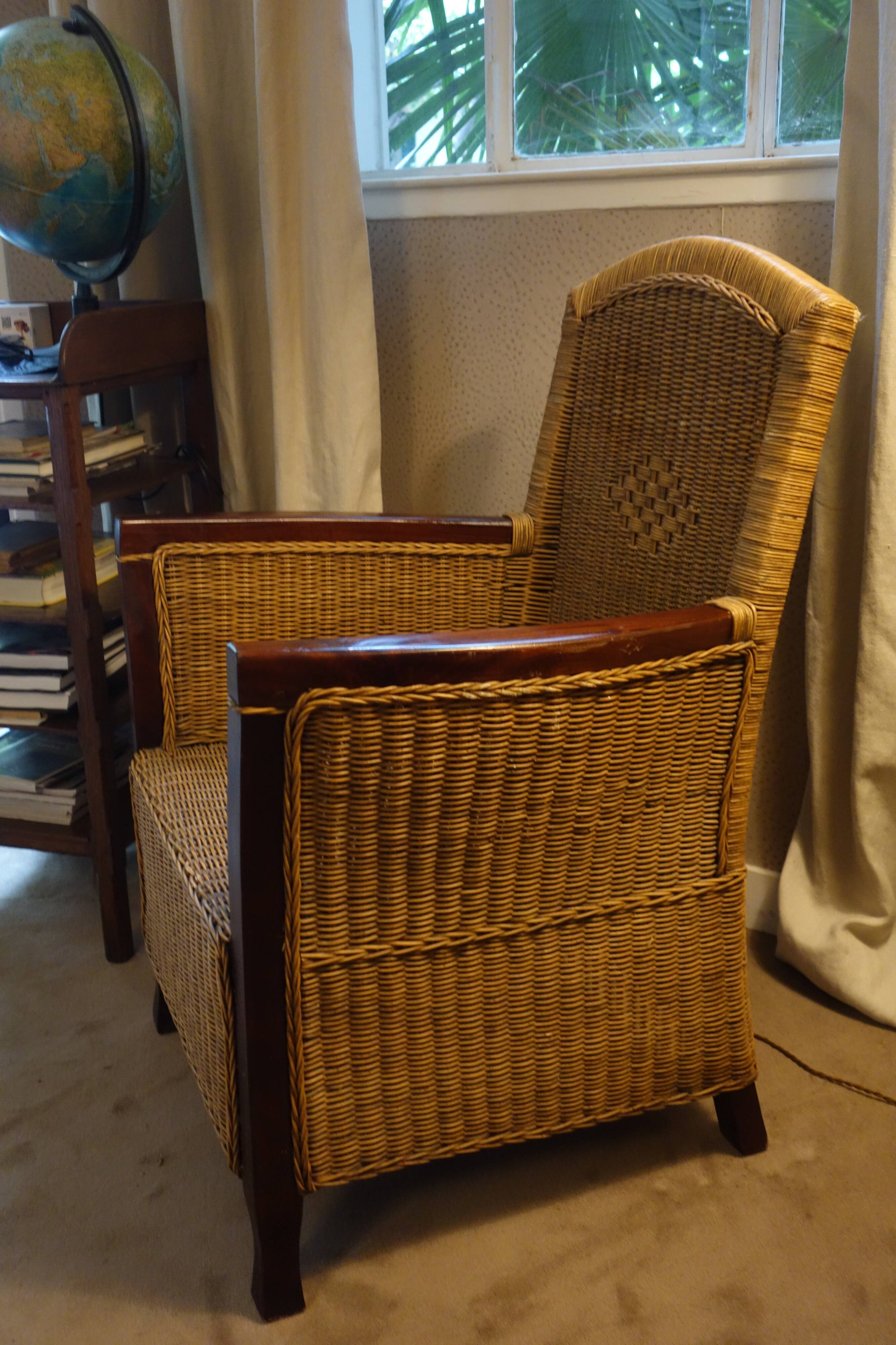 comfortable colonial-style armchair in rattan and mahogany